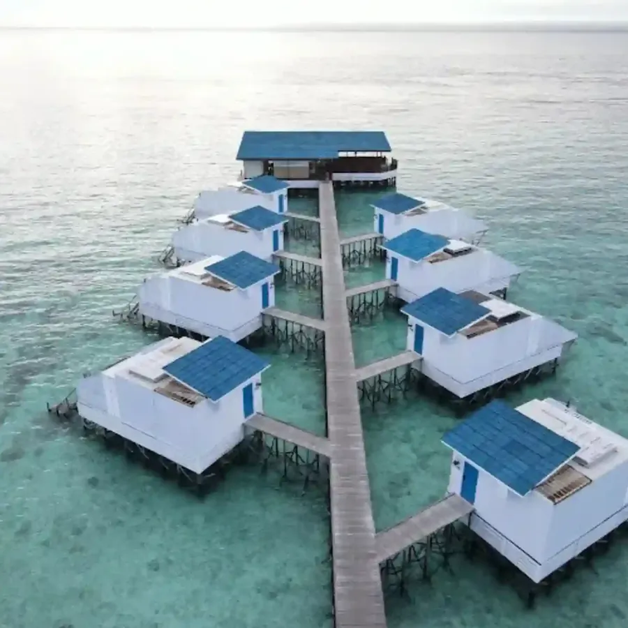 Aerial view of the white floating villas of Arasatu