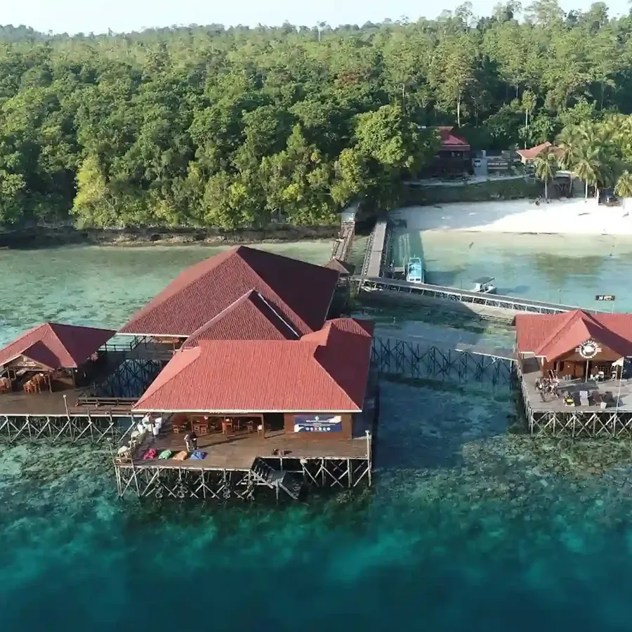 Aerial view of the red-roofed over-water buildings of Pratasaba